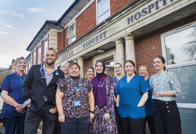 Group of clinical staff outside a hospital