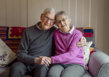 Humphrey and Margaret sitting armed crossed together